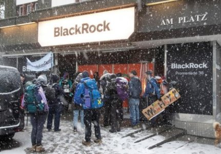 Climate activists protest in front of a showroom that hosts BlackRock, ahead of the World Economic Forum (WEF) 2023, in the Alpine resort of Davos, Switzerland, January 15, 2023. 