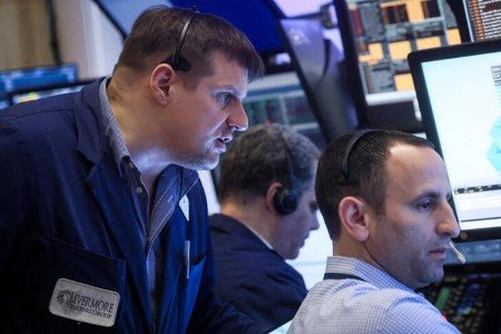 Traders work on the floor of the New York Stock Exchange (NYSE) in New York City, U.S., March 29, 2023. 