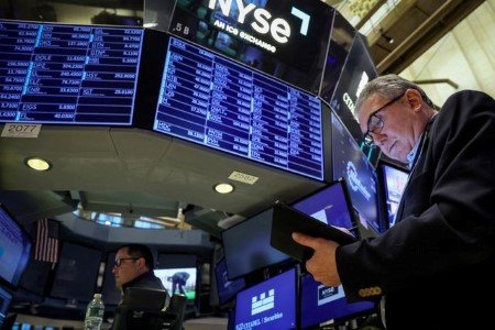 Traders work on the floor of the New York Stock Exchange (NYSE) in New York City, U.S., March 29, 2023. 