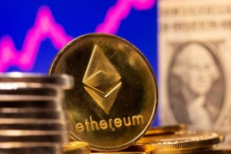 A representation of virtual currency Ethereum and U.S. One Dollar banknote are seen in front of a stock graph in this illustration taken February 19, 2021. A representation of virtual currency Ethereum and U.S. One Dollar banknote are seen in front of a stock graph in this illustration taken February 19, 2021.