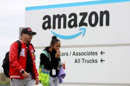 Amazon workers walk outside Amazon?s LDJ5 sortation center, as employees begin voting to unionize a second warehouse in the Staten Island borough of New York City, U.S. April 25, 2022. Amazon workers walk outside Amazon?s LDJ5 sortation center, as employees begin voting to unionize a second warehouse in the Staten Island borough of New York City, U.S. April 25, 2022.