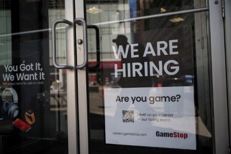 A sign for hire is posted on the door of a GameStop in New York City, U.S., April 29, 2022. 