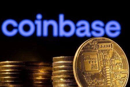 A representation of the cryptocurrency is seen in front of Coinbase logo in this illustration taken, March 4, 2022. A representation of the cryptocurrency is seen in front of Coinbase logo in this illustration taken, March 4, 2022.