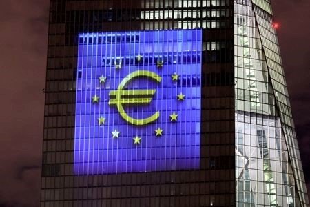 A file photo of a symphony of light consisting of bars, lines and circles in blue and yellow, the colours of the European Union, illuminating the south facade of the European Central Bank (ECB) headquarters in Frankfurt, Germany, December 30, 2021. 