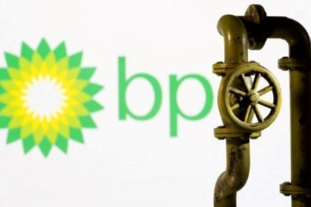 A 3D-printed natural gas pipeline is placed in front of displayed BP logo in this illustration taken February 8, 2022.