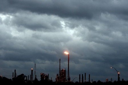 A file photo of dark clouds seen above a refinery as Hurricane Ike approaches the Gulf of Mexico near Houston, Texas September 12, 2008. 
