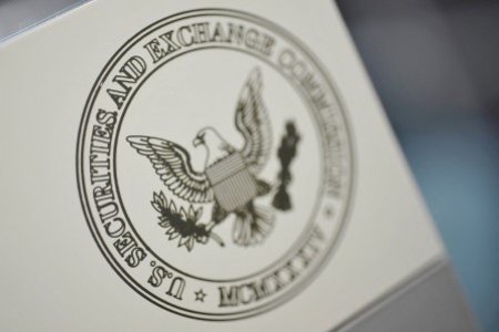 A file photo shows the U.S. Securities and Exchange Commission logo on an office door at the SEC headquarters in Washington, June 24, 2011.