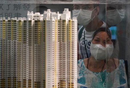 Potential homebuyers view a model in Kwun Tong, Hong Kong