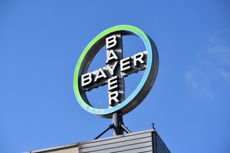 The Bayer company logo stands on top of a roof