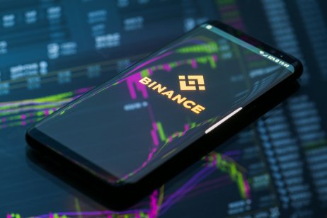 Binance logo on a phone