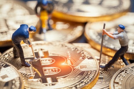 Miniature figures illustrate Bitcoin mining