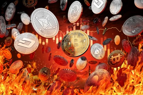 cryptocurrency coins on red fiery background