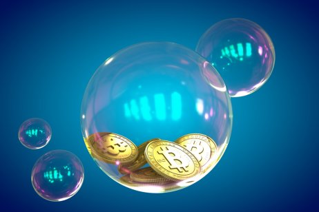 A bubble containing cryptocurrency coins