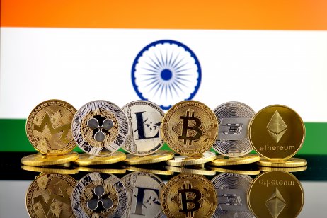 A range of cryptocurrencies in front of the Indian flag