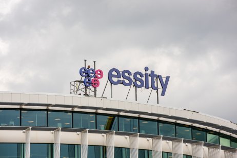 A picture of a logo of Essity on top of a building being dismantled