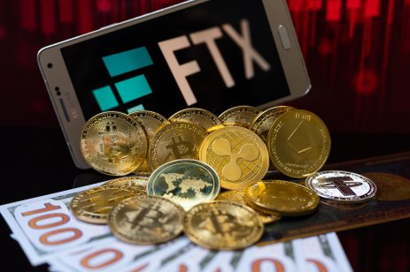 FTX logo surrounded by cash and cryptocurrencies