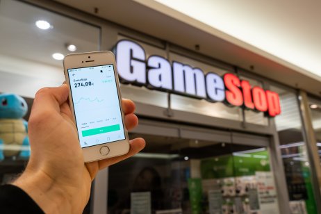 GameStop stock price appears on a cell-phone readout outside a store