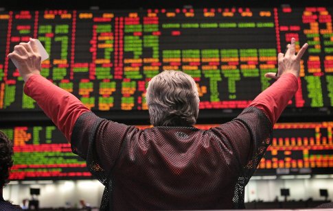 A trader signals an offer in the Standard & Poors 500 stock index futures pit at the CME Group December