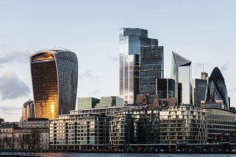 View of the City of London’s illuminated financial district skyline at dusk