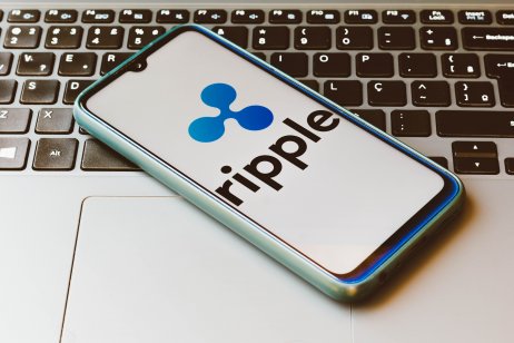 The Ripple (XRP) logo displayed on a smartphone
