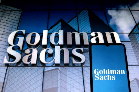  In this photo illustration a Goldman Sachs Group logo seen displayed on a smartphone with a Goldman Sachs Group logo in the background