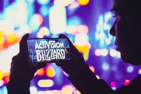 A image of Activision Blizzard logo is displayed on a smartphone