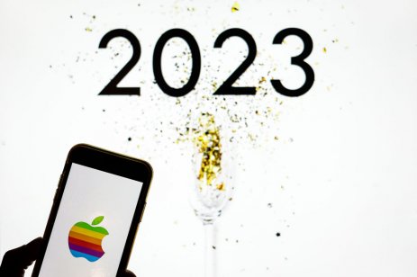 A image of an Apple iPhone against a sign of 2023