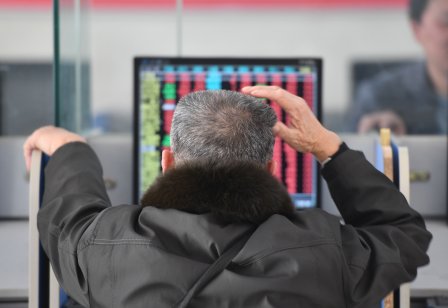 A stockholder watches the stock market at a securities sales department in Fuyang City, Anhui Province, China, Feb. 20, 2023