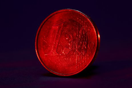 One Euro coin on black background 