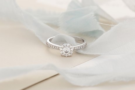 Platinum wedding ring on a plain background