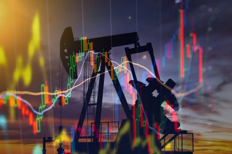 Oil pump on the background of stock charts to illustrate volatile oil prices 