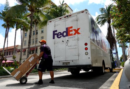 FedEx worker makes a delivery in Miami Beach, Florida