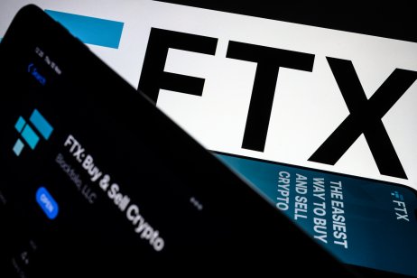 A series of smartphones display the FTX logo and mobile app adverts