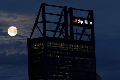 Moon rises of over the BHP building in Perth