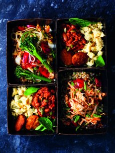 Colourful food in takeaway boxes