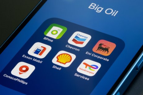 Illustration of big oil company logo apps on a smartphone 