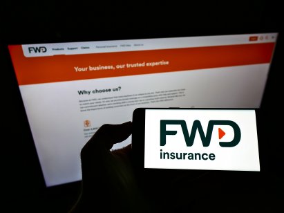 Person holding smartphone with logo of FWD Group