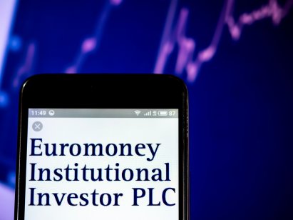 Euromoney Institutional Investor logo seen displayed on a smart phone with a purple background