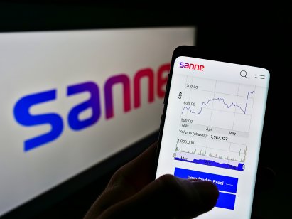 Sanne logo with person holding a smartphone with the share price