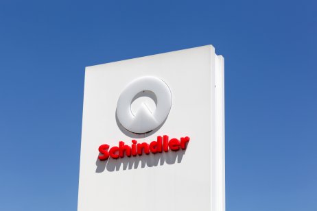 The white and red Schindler logo seen on a sign
