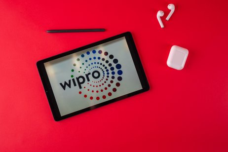 An image of Wipro's logo on a tablet