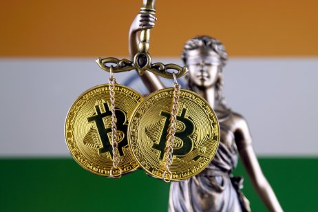 Symbol of law and justice, physical version of Bitcoin and India Flag. Prohibition of cryptocurrencies, regulations, restrictions or security, protection, privacy