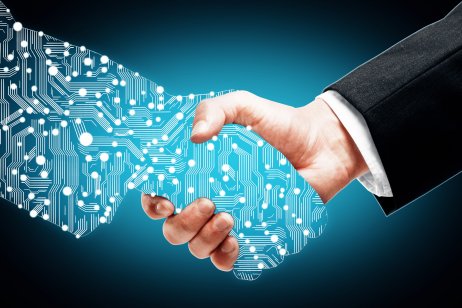 A picture of a businessman shaking hands with digital partner