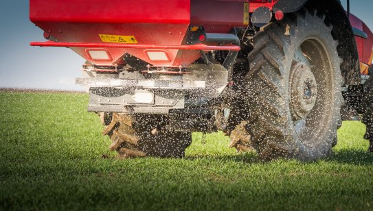 Tractor fertilising field