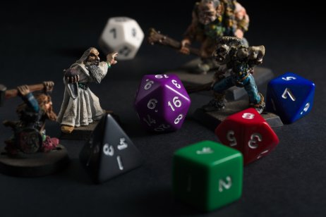 A picture of Dungeons and Dragons dice and hand painted lead figures produced by Games Workshop