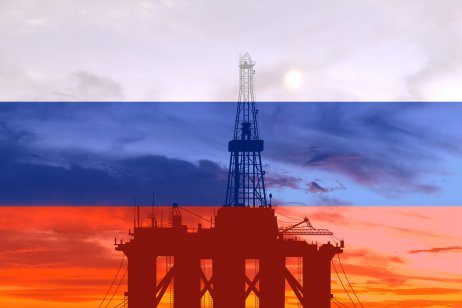 Oil platform at sea on the background of the Russian flag