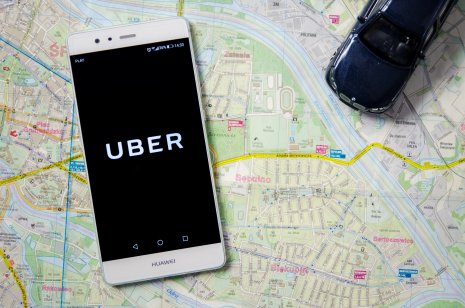 Uber stock forecast: Facing a surge in operational challenges? Uber logo on Huawei P9. Uber is sharing-economy service for ubran transport.
