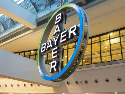 Bayer sign light board in Frankfurt international airport is rotating around , Pharmaceutical company