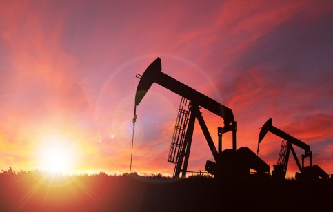 Oil pump jack at sunset 