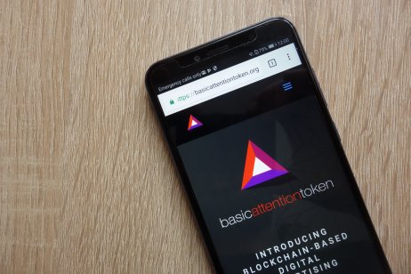The basic attention token logo on a smartphone screen
